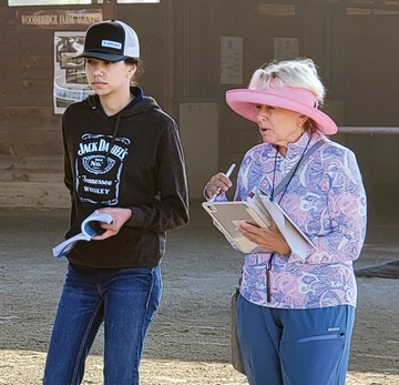 Stephanie listens closely as bloodstock agent Gayle Van Leer looks at horses for her clients.
