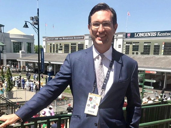 Jim Mulvihill standing by the Churchill Downs paddock