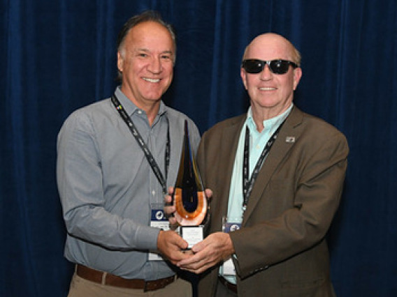 Ted Nicholson receiving award