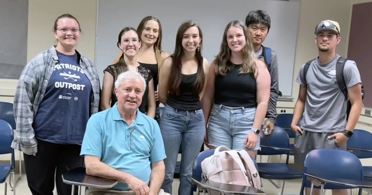 Tom Clark with RTIP students in classroom