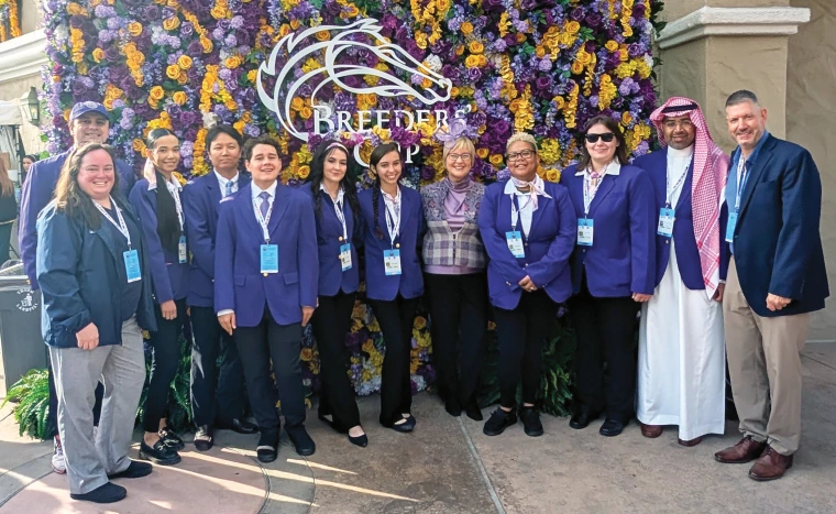 RTIP professors and students pose for a picture with Caton Bredar at the Breeders’ Cup.