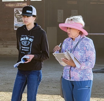 Stephanie listens closely as bloodstock agent Gayle Van Leer looks at horses for her clients.